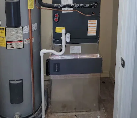 Technician performing professional duct cleaning on a residential HVAC system
