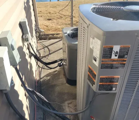 Split-system heat pump condenser for dual fuel heating and cooling